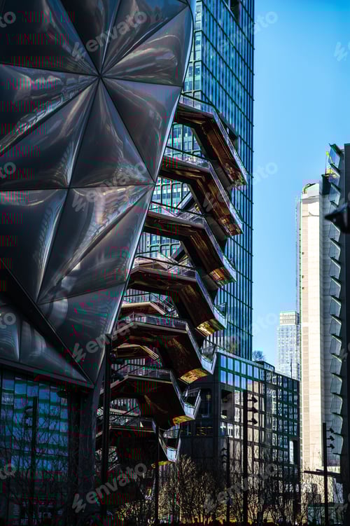 Preview: Visitor attraction and modern structure against glass walled buildings in daylight