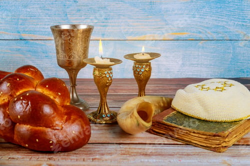 Preview: Shabbat challah bread, shabbat wine and candles on the table Jewish Holiday