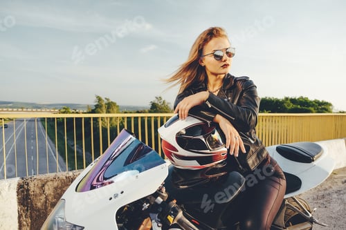 Preview: Woman in Leather Jacket on Motorcycle Bridge