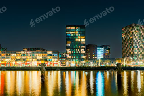 Preview: Panoramic view of the night city. Rotterdam city skyline. City towers illuminated panorama
