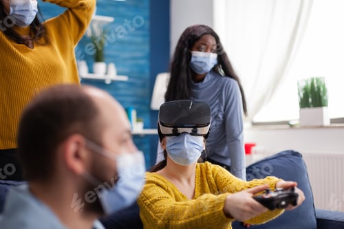 Preview: Woman experiencing virtual reality playing video games