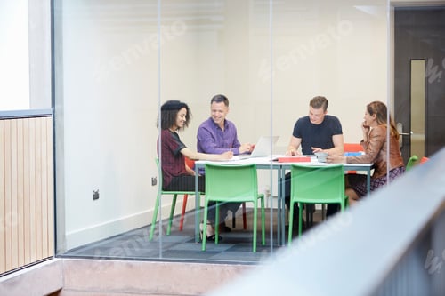 Preview: Design team meeting at design studio boardroom table