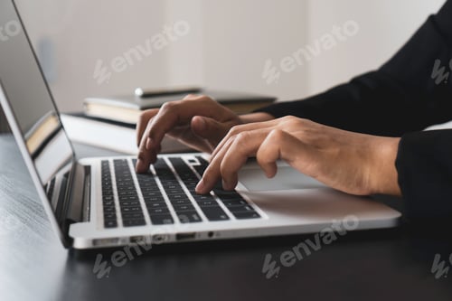Preview: close up of a woman hand typing on the keyboard at home office typing for check electronic mail to p