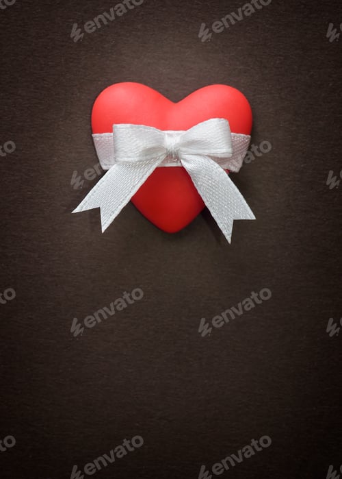 Preview: Red Heart with Bow on a Brown Background