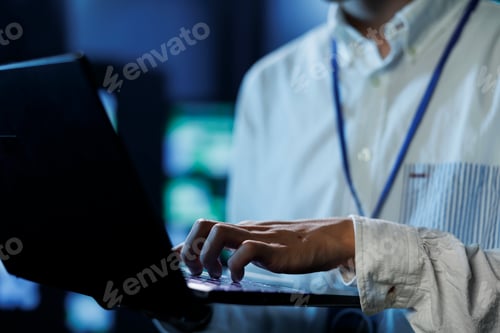 Preview: Man in data center with laptop, close up