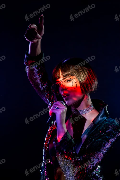 Preview: Stylish woman singing on stage