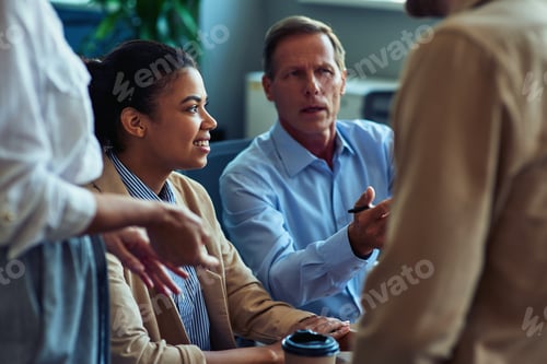 Preview: Group of multiracial business people having a meeting in the modern office or coworking space