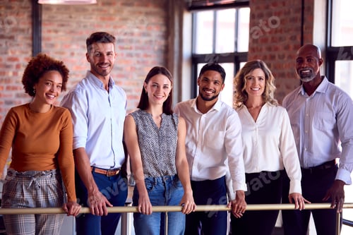Preview: Portrait Of Multi-Cultural Business Team Meeting In Busy Office