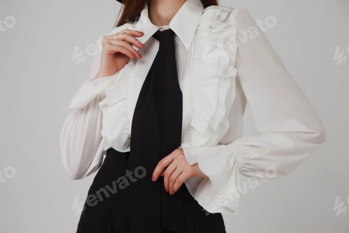 Preview: Stylish cute young businesswoman in black elegant blouse and hat