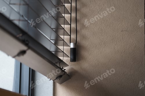 Preview: Details of a window blind mechanism in a room