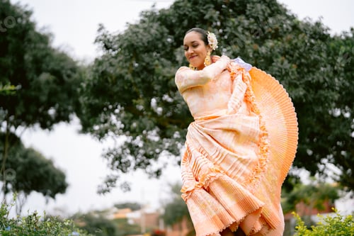 Preview: Young woman dancing peruvian marinera in traditional dress
