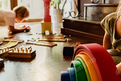 Preview: Children play with colorful wooden toys on floor