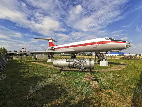Preview: Closeup shot of an aircraft with a red line in the middle under a bright sky