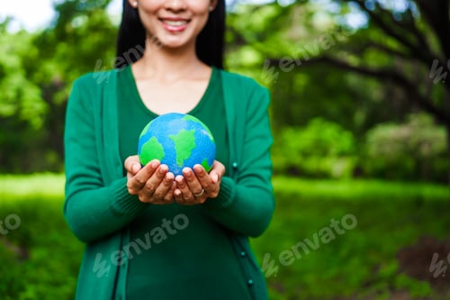 Preview: A male hand holds a hammer, symbolizing the enforcement of tree conservation laws. This highlights