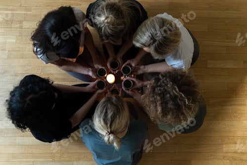 Preview: Women friends holding cups of hot tea.