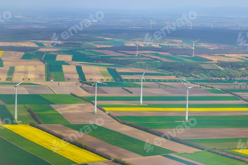 Preview: Wind turbines harnessing energy in lush green fields at Vienna, Austria