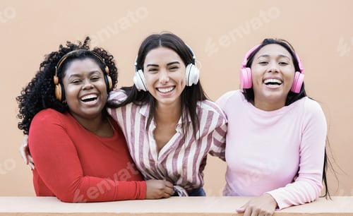 Preview: Young multiracial women having fun together outdoor in the city