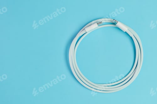 Preview: Cable with usb type C and lightening on the blue background with copy space
