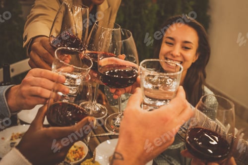 Preview: Family and friends celebrating at dinner on a rooftop terrace