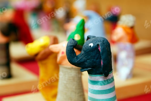 Preview: Fun elephant-shaped craft made of paper by a child, focus on the foreground.