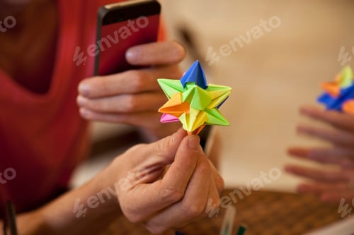 Preview: Students playing origami paper game
