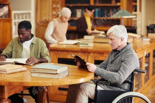 Preview: Senior Man in Wheelchair in Library