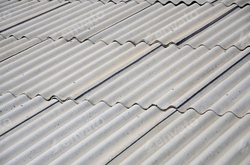 Preview: A fragment of a gray slate roof of an old sample made of asbestos material