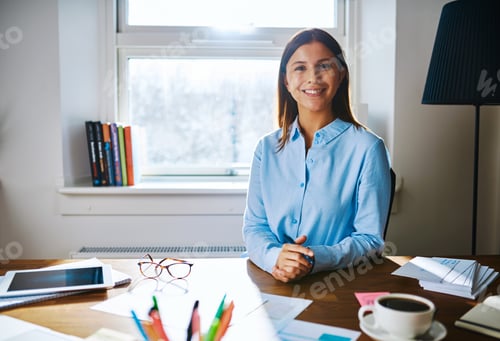Preview: Confident smiling woman at desk