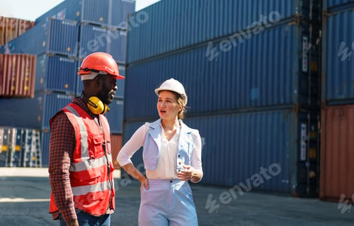 Preview: Foreman control loading Containers box from Cargo freight ship for import export.