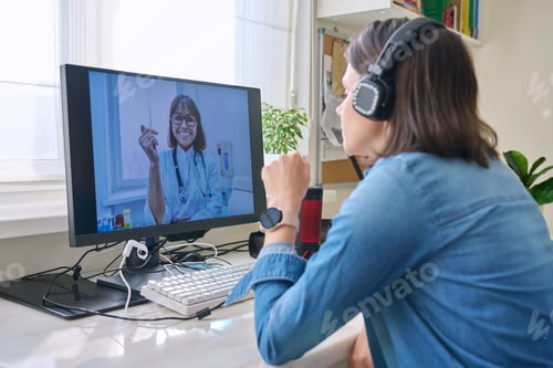 Preview: Woman talking to doctor using video call on computer