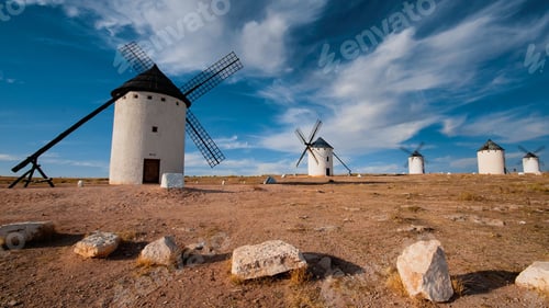 Preview: Line of Windmills of Campo de Criptana village in La Mancha region, Spain with blue sky