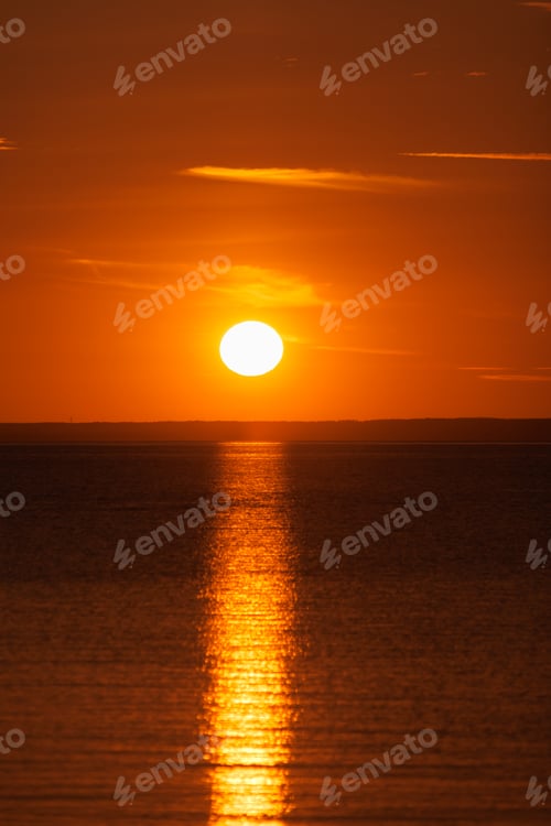 Preview: sunset on background of ocean or sea, beautiful orange color in nature. freedom and rest