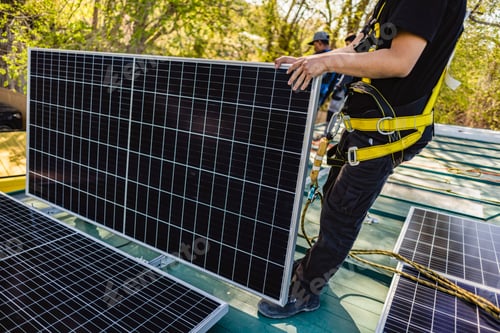 Preview: Two workers technicians installing heavy solar photo voltaic panels