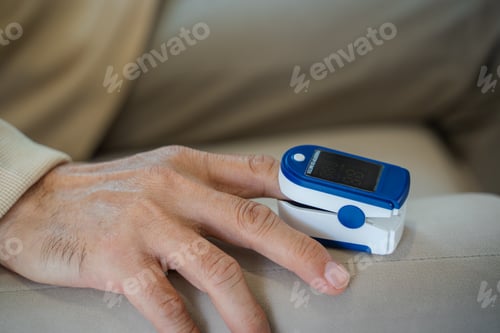 Preview: Close up of a pulse oximeter on a patient's finger.