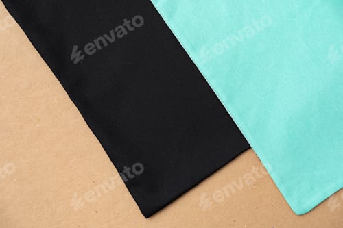 Preview: Black textile shopping bag on beige background flat lay
