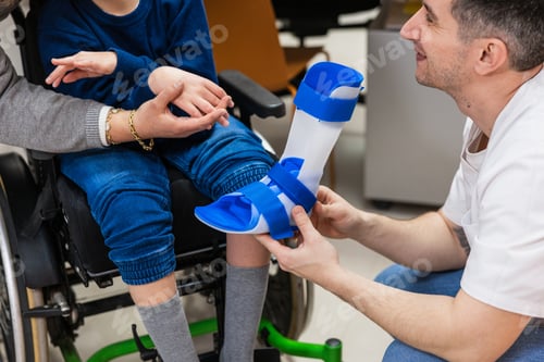 Preview: Child receiving orthosis fitting from orthopedist