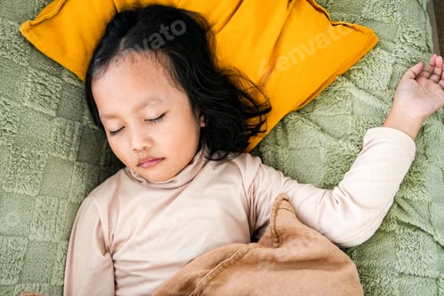 Preview: Peaceful Little Girl Sleeps On Soft Green Blanket With Pillow