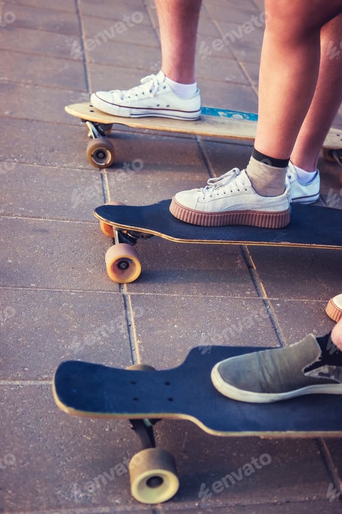 Preview: Skater's legs on longboards.