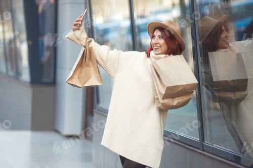 Preview: Street style portrait of happy millennial fashion woman 30-35 years old with many craft bags