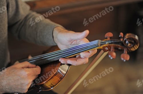 Preview: man and violin with score