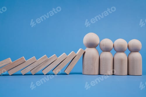 Preview: Fallen wooden pieces override lined up wooden figurines