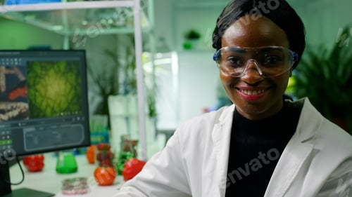 Preview: Close up of african biologist doctor wearing medical equipment