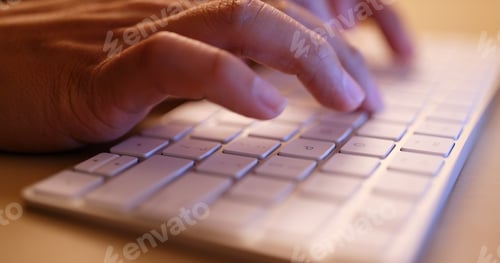 Preview: Typing on laptop computer