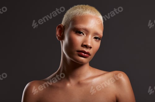Preview: Beauty, makeup and dark portrait of black woman in studio with platinum hair isolated on grey backg