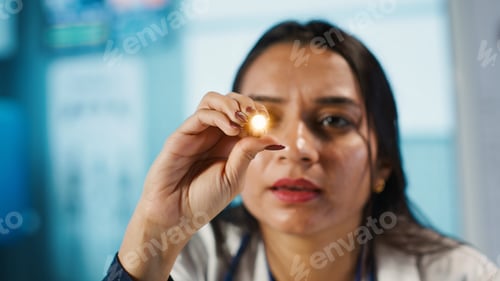 Preview: Optometrist examining eyesight with diagnostic tools for a male patient