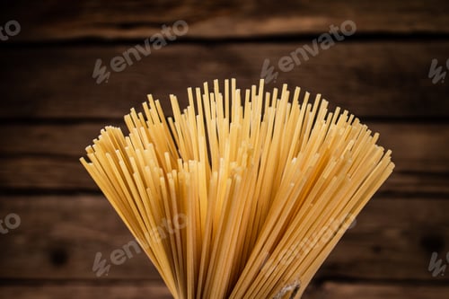 Preview: A bunch of spaghetti dry tied with a rope.