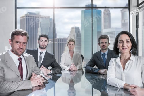 Preview: Portrait of confident businessmen and businesswomen sitting in conference room