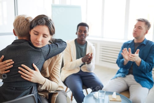 Preview: Psychologist Embracing Patient in Support Group