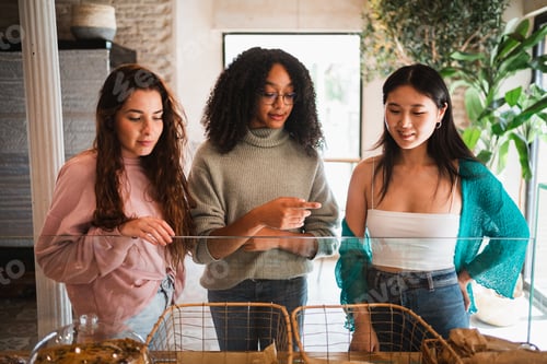 Preview: A group of friends choosing what to order at a brunch cafe. Bakery showcase.
