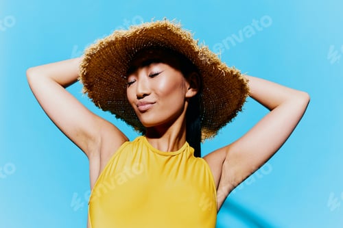 Preview: Woman portrait summer smile happiness beauty fashion yellow swimsuit hat trendy